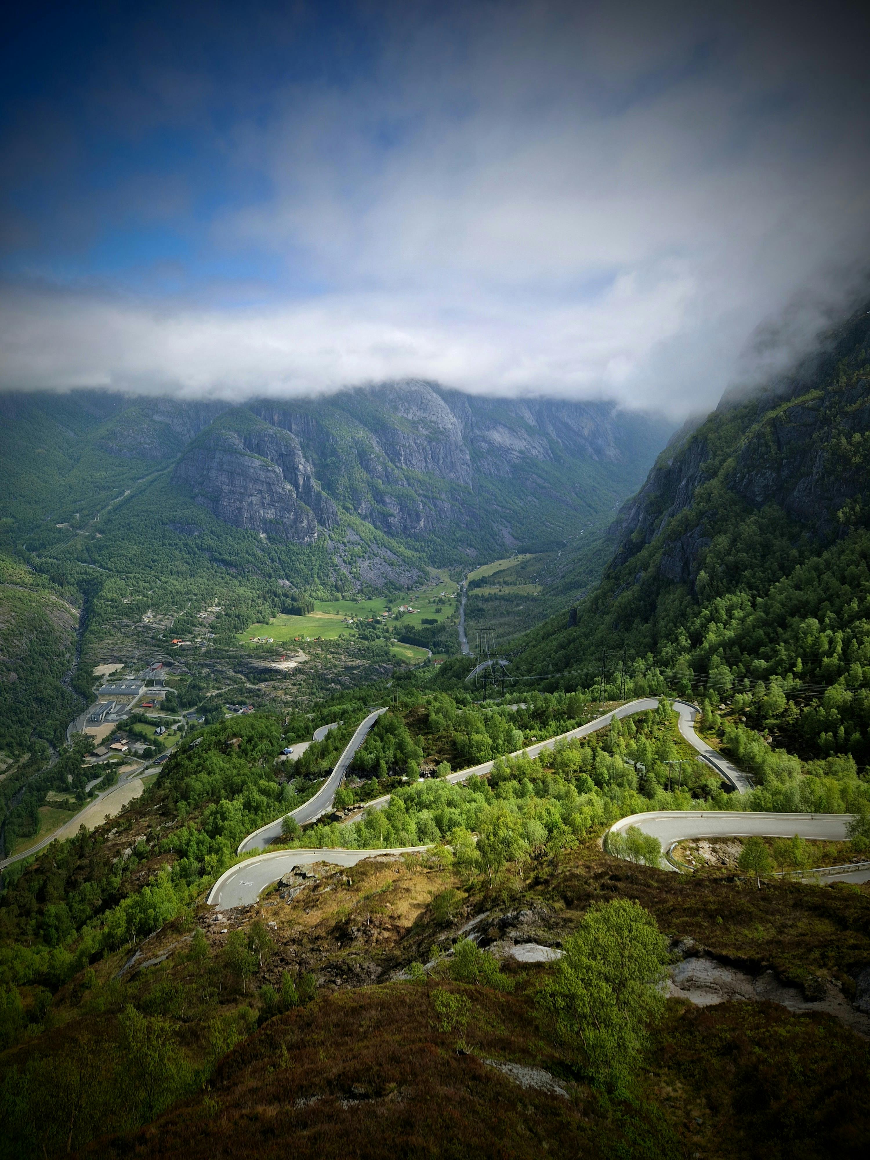 Eagle Road hairpin bends climbing from Geiranger village into the mountains above the green valley