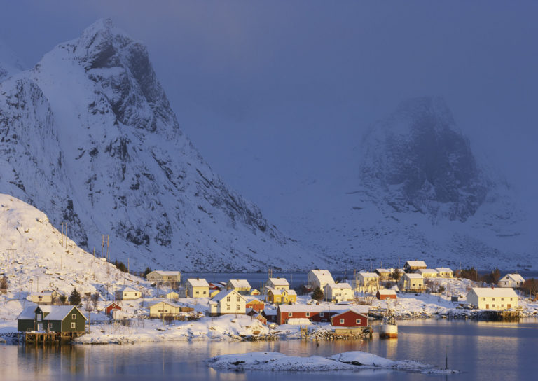 Reine fishing village in winter beneath the granite peaks of Moskenesøya