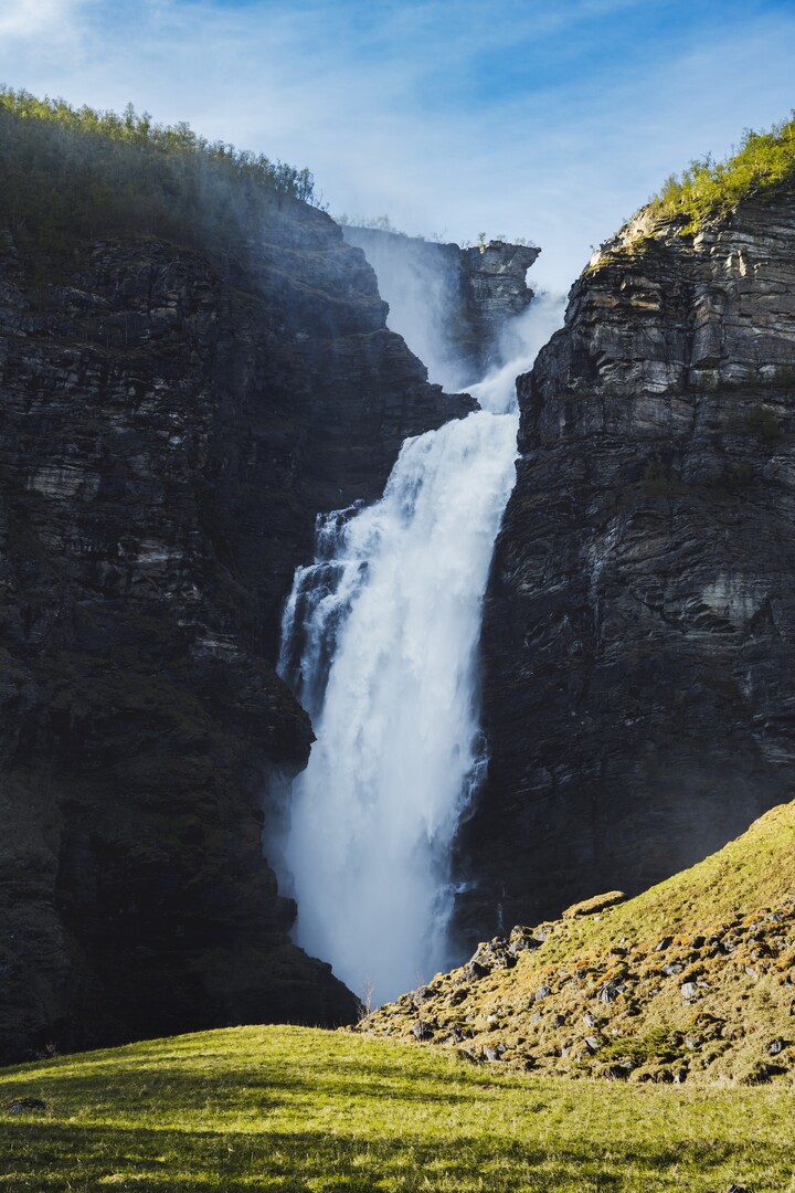 Lyngen Alps panoramic ridge with glaciated peaks and snowfields extending toward the fjord